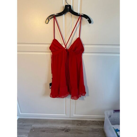 Spaghetti strap chiffon baby doll dress with a v-neckline, crisscross back, and - Picture 7 of 10